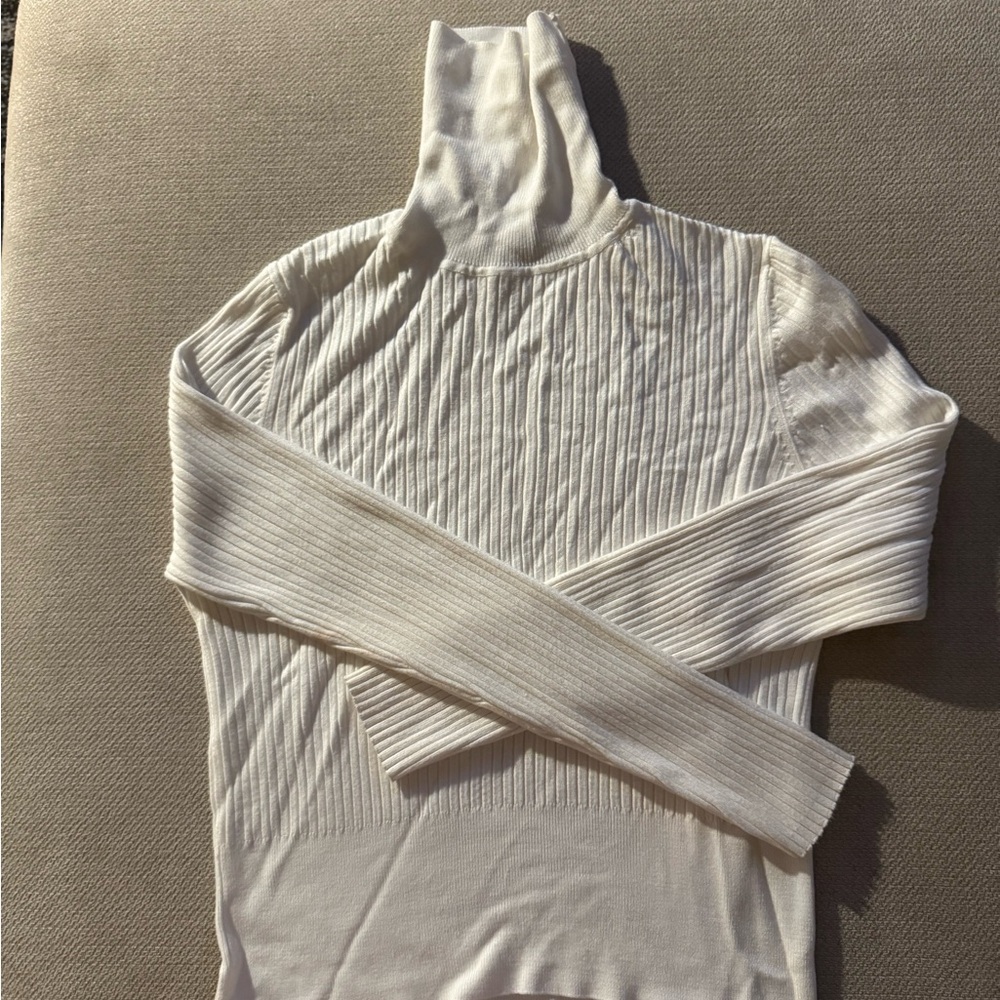 White ribbed turtleneck sweater